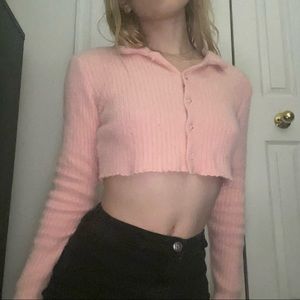 Pink cropped sweater.